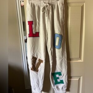 cream sweatpants with LOVE detail. from aerie, size medium
